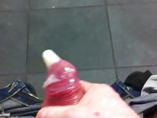 Cum filling a condom in a public bathroom