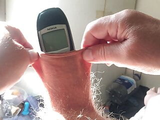 Three minutes of foreskin stretch in sunlight: phone  
