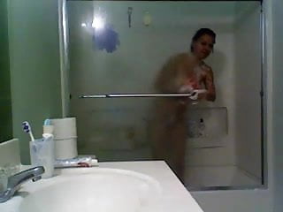 Girl in glass taking a shower
