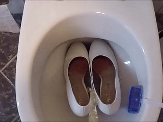 Piss in white high heels