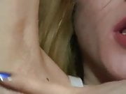 Blond girl spits on her armpits and lick them