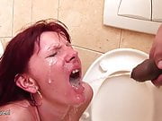 Mom gets deep throat and pissing on a public toilet
