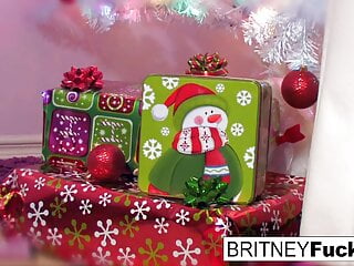 Britney finds a Christmas gift under the tree perfectly