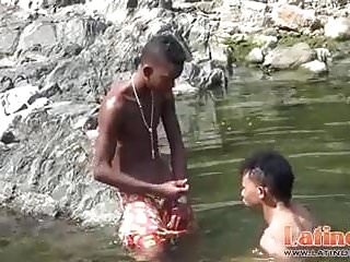 Teen playfully going down in the river...
