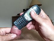 Foreskin with bat and pin, and phone 