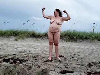 Mature BBW being silly and walking on nude beach.
