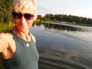 Swimming in the lake in sport wear at sunset.. Wet leggings and t-shirt…