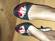 Black Mules and red Toenails