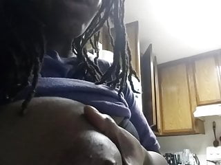 Ebony squeezes milk from her big black boob for Youtube