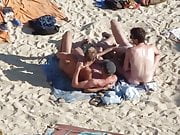 Group of guys having sex on the beach