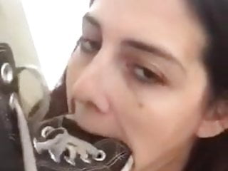Degraded whore licking her shoe