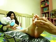 mum tickles step daughters feet