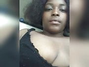 Dark skinned woman playing with her boobs on periscope