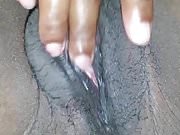 Jamaican girl playing with her phat pussy