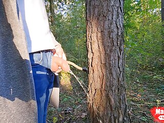 On a walk in the forest, pissing under a tree