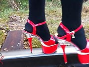 Lady L walking metal road with sexy red high heels!