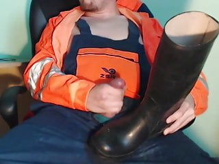 Worker cumming on rubber boots while...