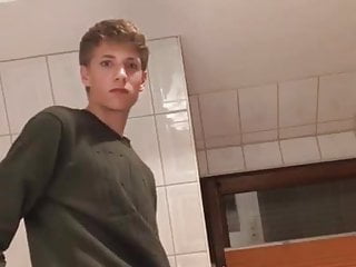 A gay man from Germany jerks off his big dick in the bathroo