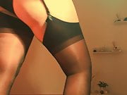 At request, putting on my stockings on, over pantyhose. 