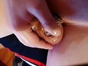 Sissy Christina shows her tiny shield chastity cage