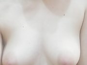 Teen girl rubbing ice on her nipples